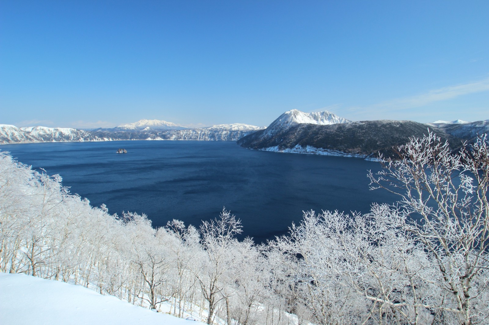 Lake Mashu covered with white snow during winter